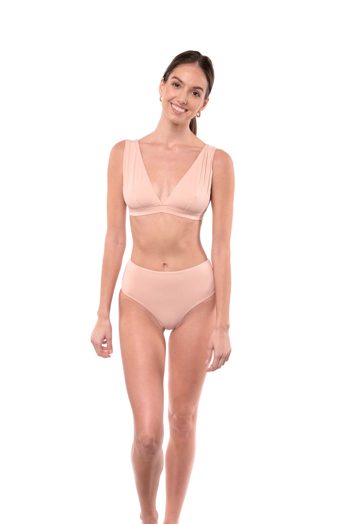Model shows the Natalie bikini top in blush on front.