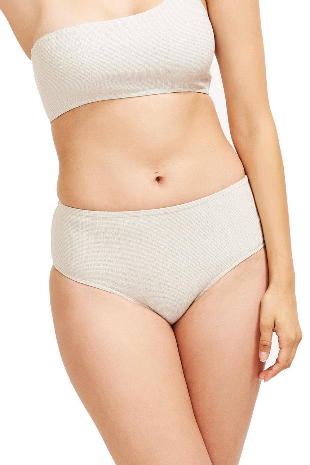 Detail of the Serena mid-rise hipster bikini bottom in textured fabric platinum.
