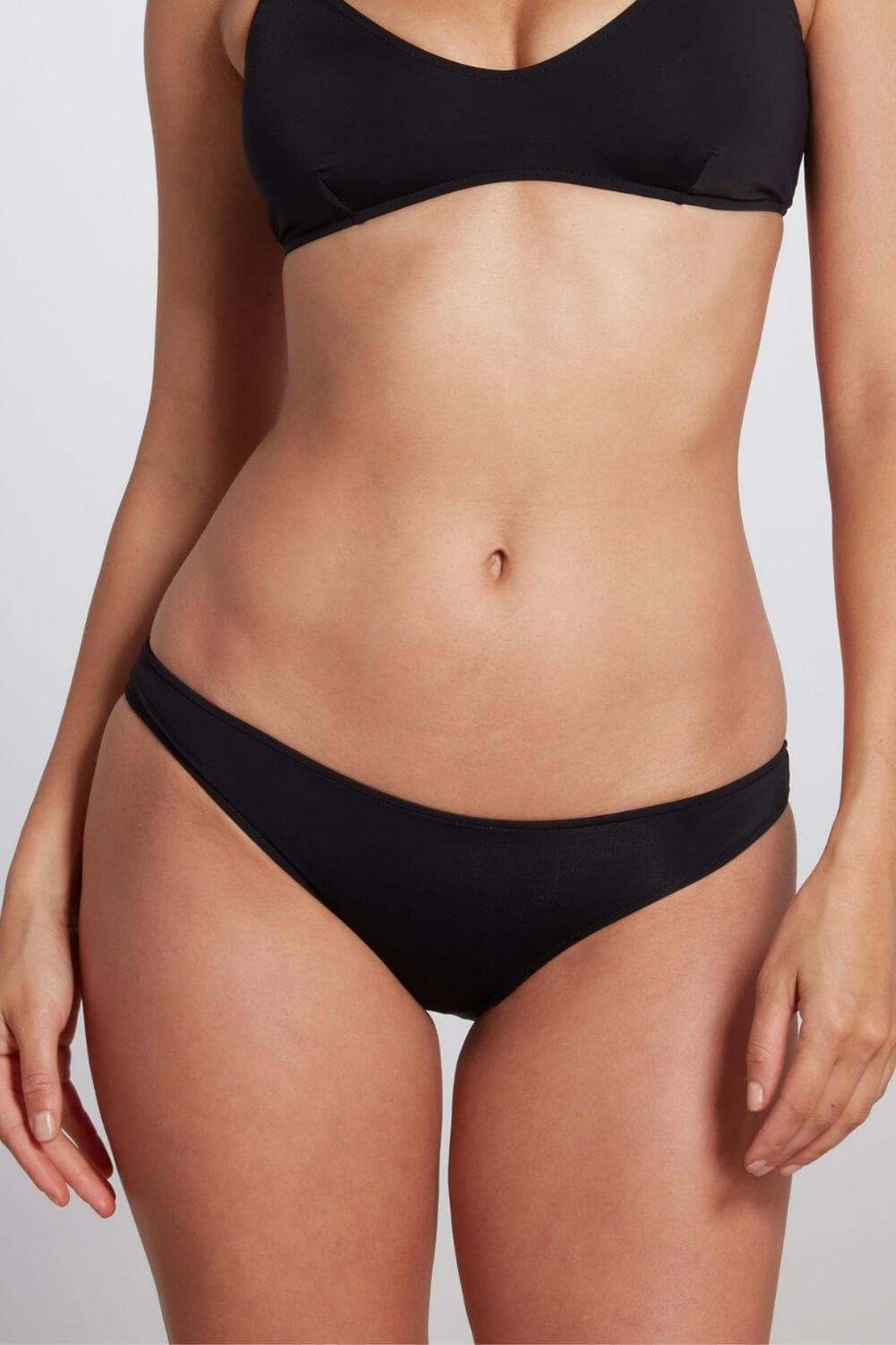 Black low rise classic brief bikini bottom, the Jenna is a staple in your summer wardrobe.