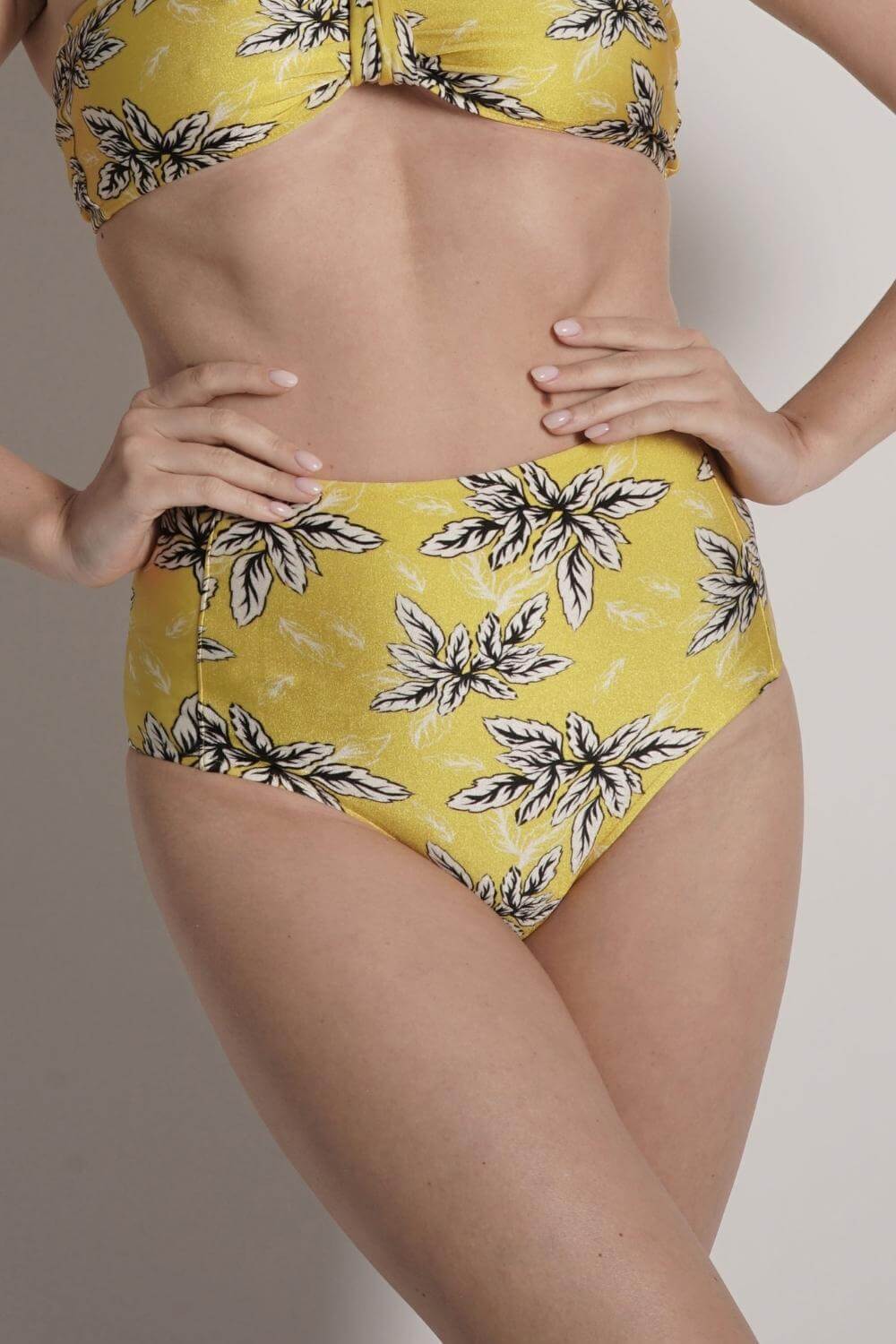 Detail of the yellow high waisted bikini bottom in our exclusive print.