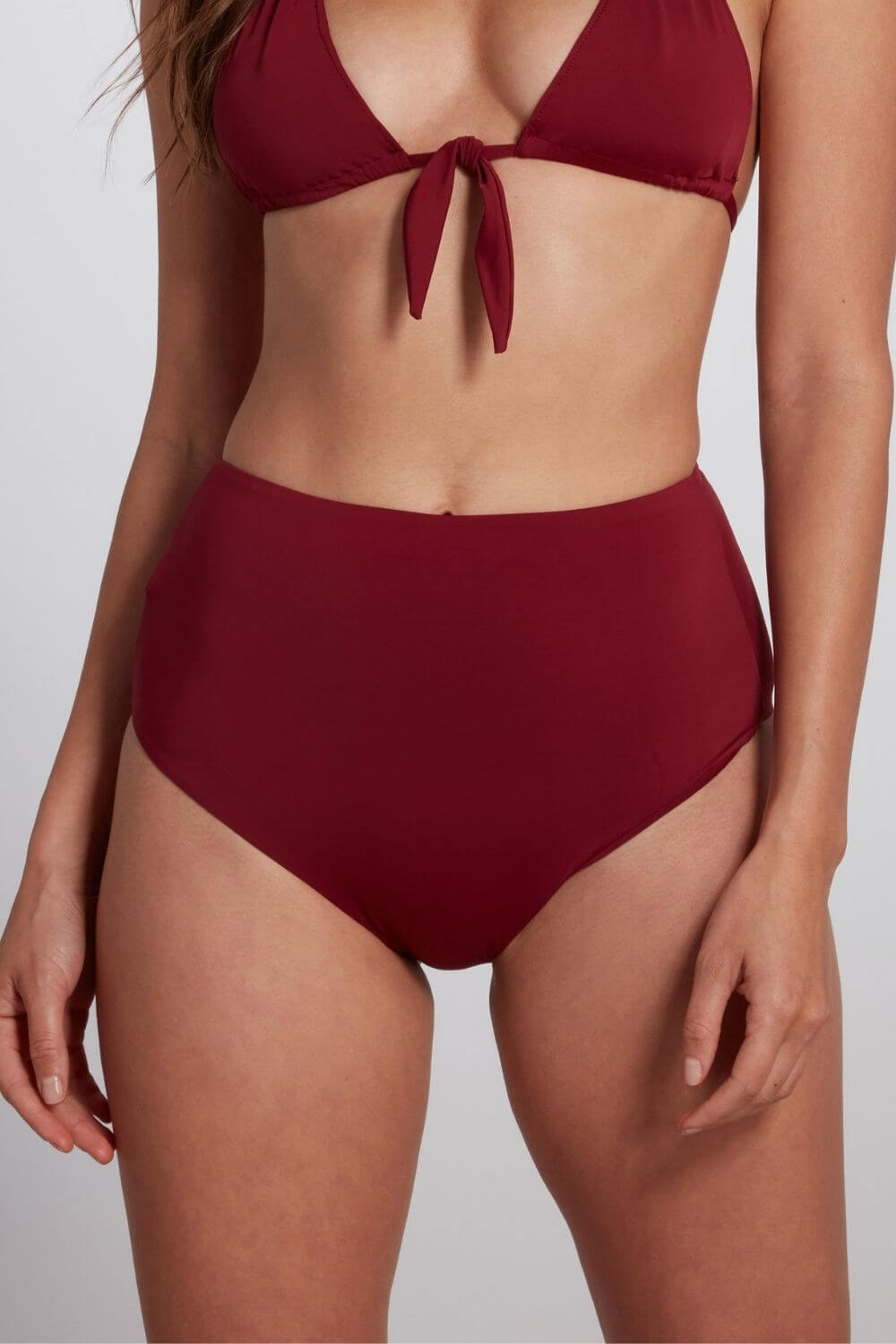 The Maya high waisted bikini bottom in burgundy.