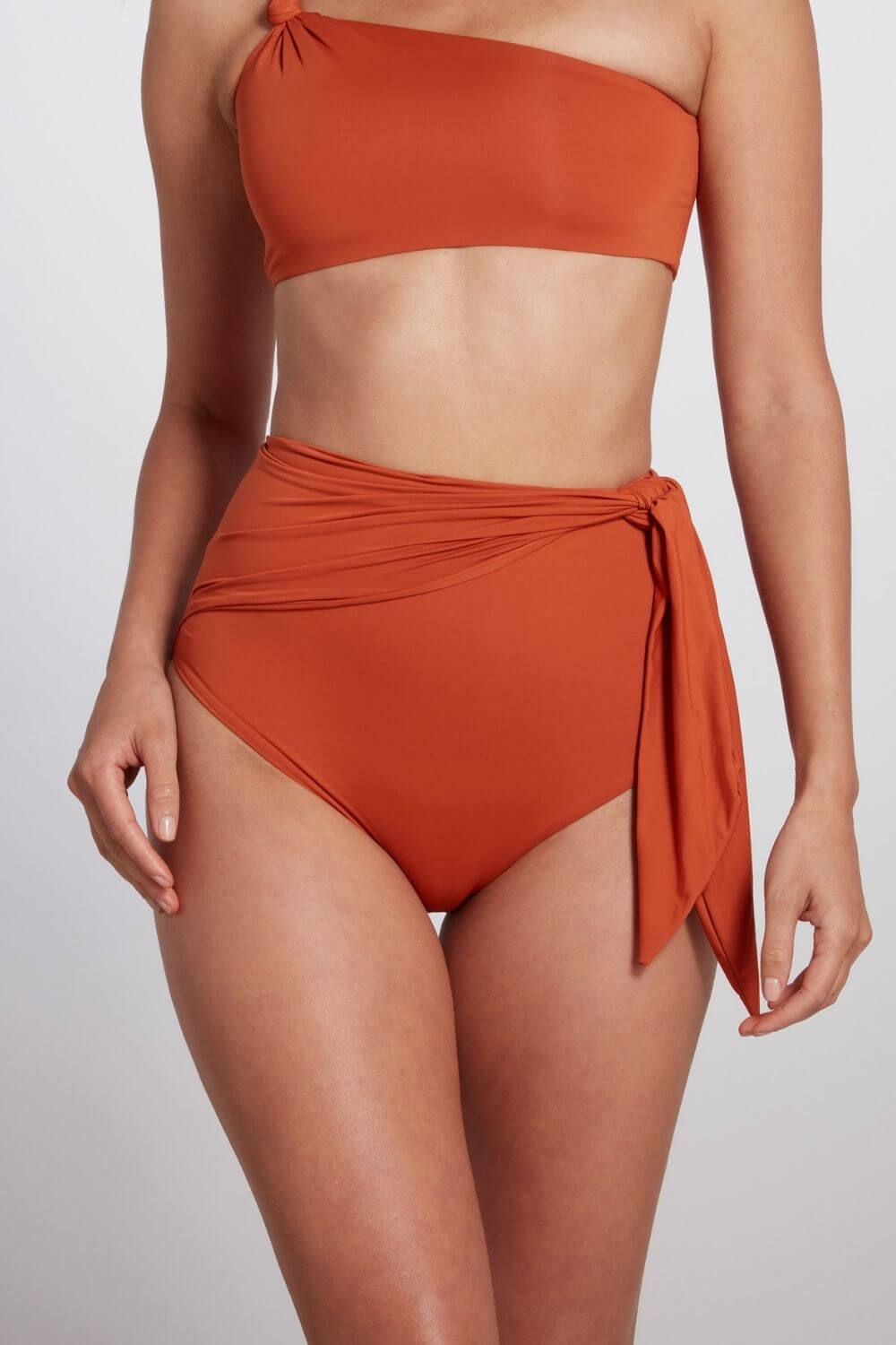 High waisted knot tie bikini bottom in orange rust.