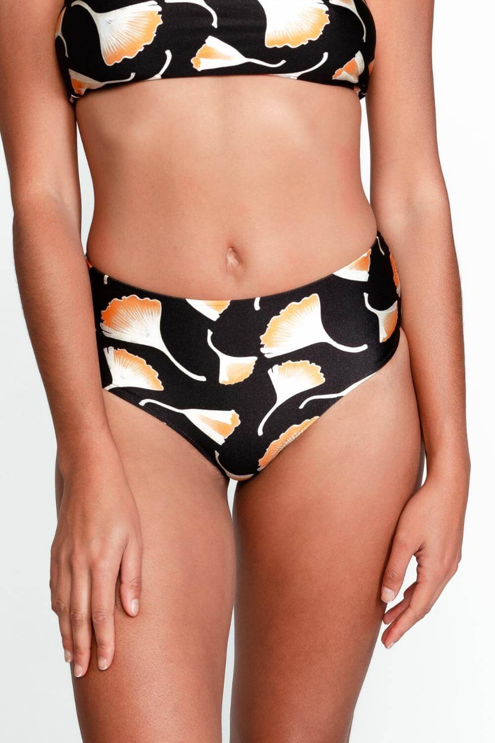 Detail of the hipster bikini bottom in black print. This mid-rise bottom offers great coverage on front and back.
