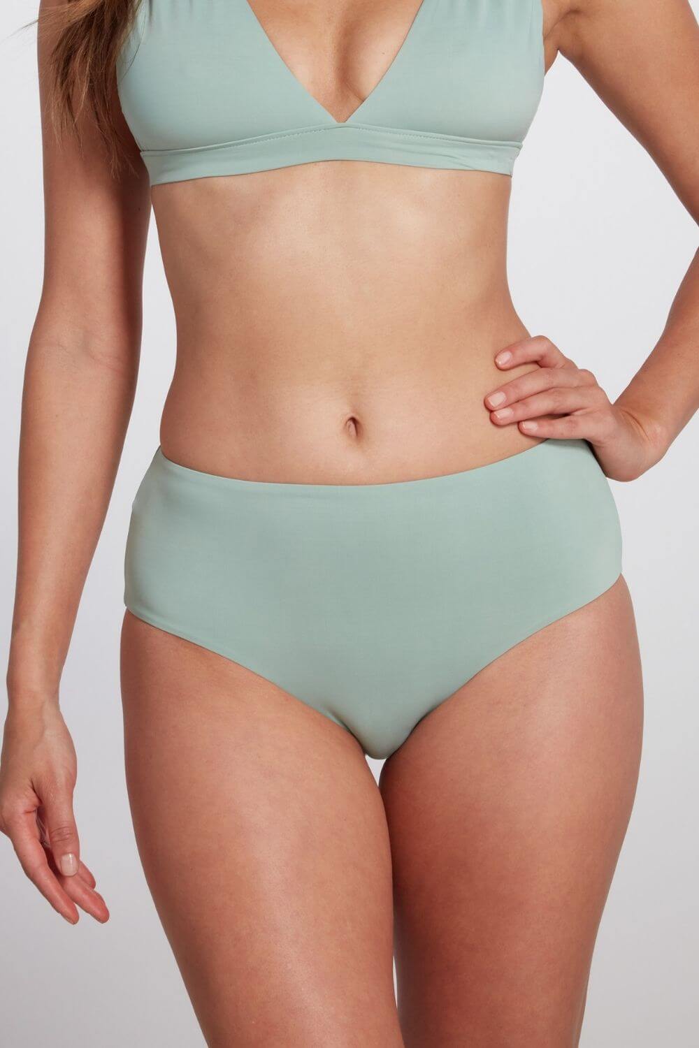 Detail of the mid rise hipster bikini bottom in sage green.