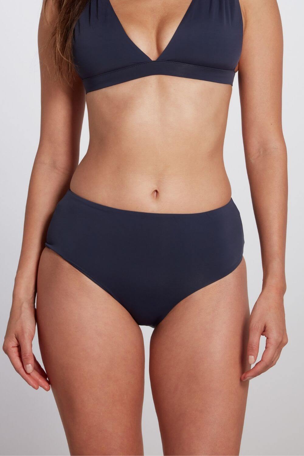 Mid-rise hipster bikini bottom in navy blue.
