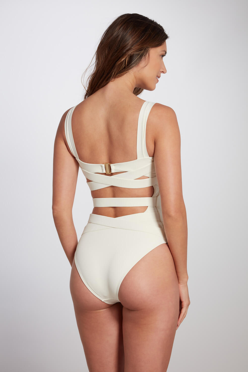 The Donatella one piece swimsuit has a unique criss cross detail on the back, closing with a high quality clasp that is heat free, rust free and hypoallergenic.