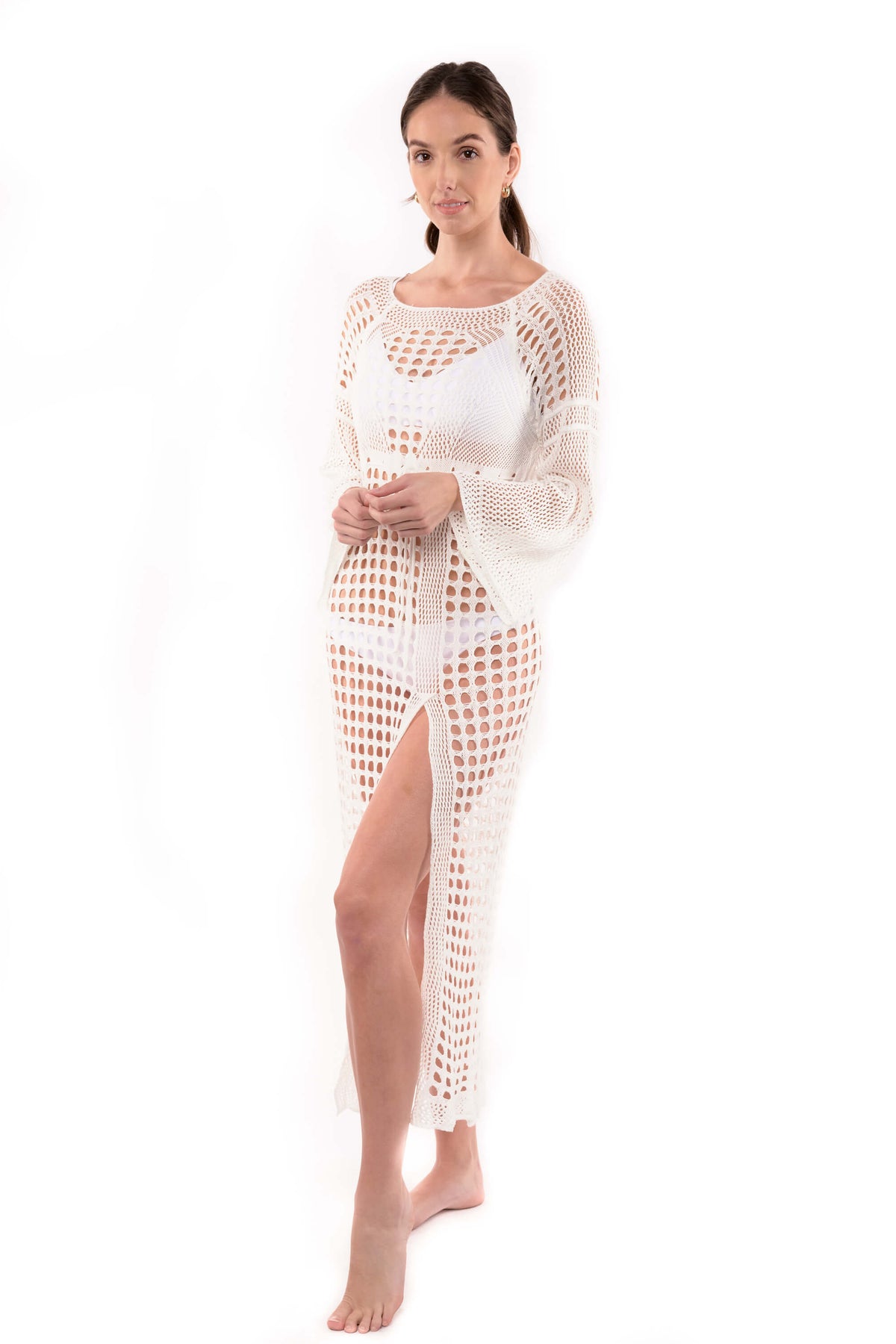 Studio photo of model wearing the Stella white crochet cover up