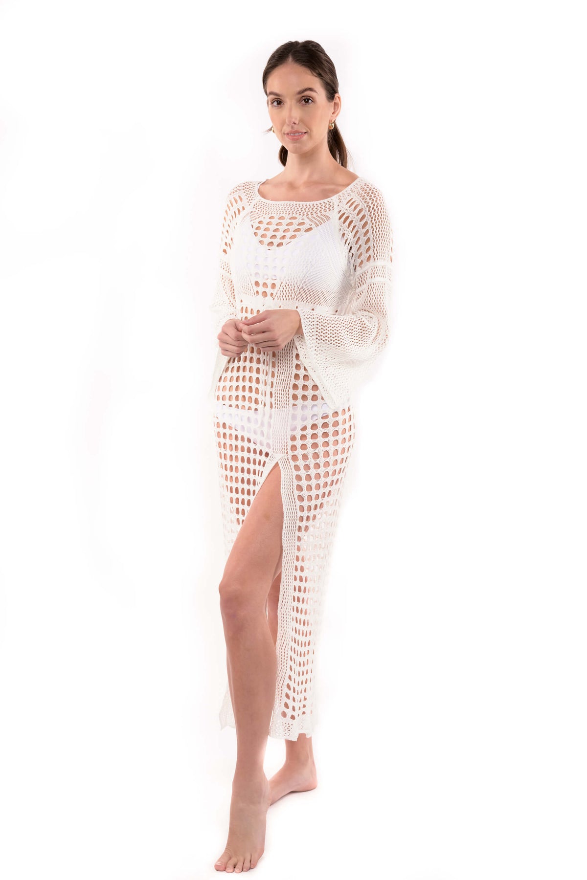 Studio photo of model wearing the Stella white crochet cover up