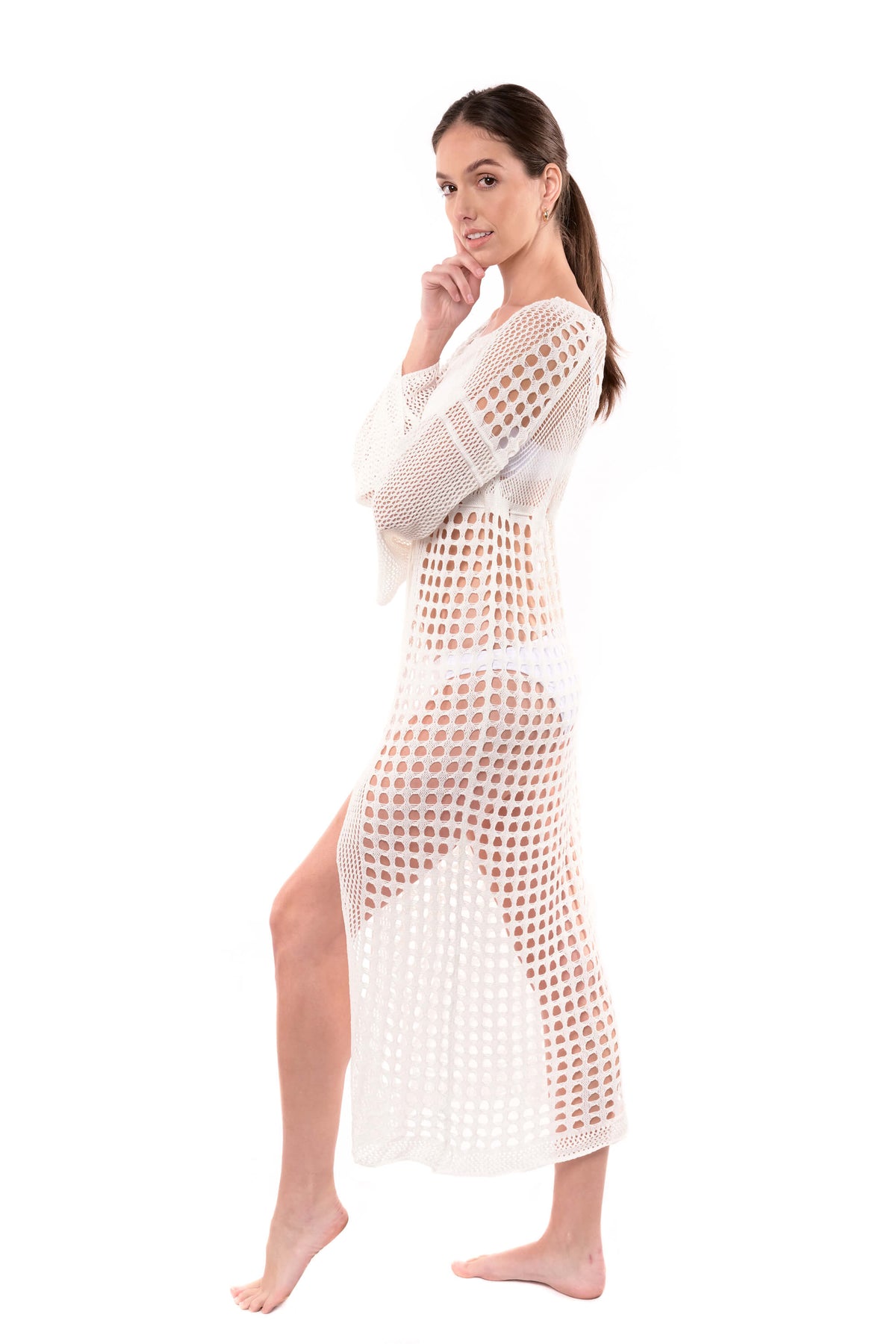 Studio photo with model showing the side of the Stella crochet white cover up