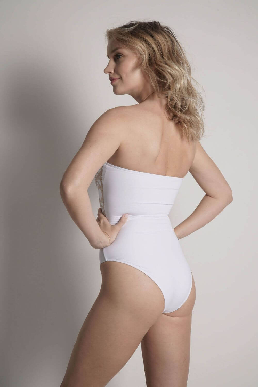The Angela white bandeau strapless bathing suit offers full coverage on the back.