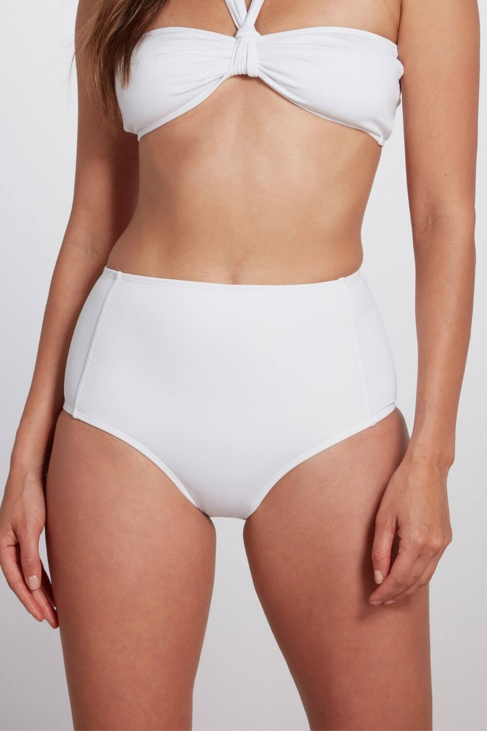 The Bianca retro high waisted bikini bottom in white is double-lined.